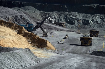 A general view of haul trucks carrying ore of the open pit of the Jwaneng Diamond Mine in Jwaneng, Botswana, on May 11, 2023. (Photo by Monirul BHUIYAN / AFP)