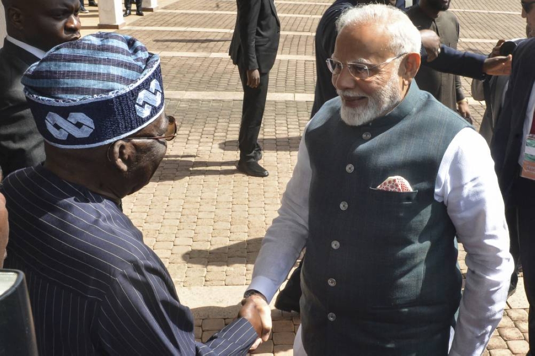 India's Prime Minister Narendra Modi (R) shakes hand with Nigeria's President Bola Tinubu upon arriving at the Presidential Palace in Abuja on November 17, 2024