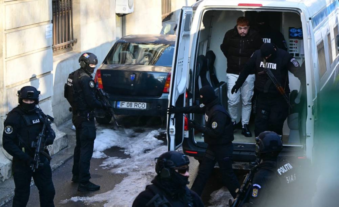 French convict Mohamed Amra (C) gets out of a van as policemen escort him to the court of appeal in Bucharest, Romania, on February 23, 2025. Ph. AFP