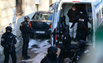 French convict Mohamed Amra (C) gets out of a van as policemen escort him to the court of appeal in Bucharest, Romania, on February 23, 2025. Ph. AFP